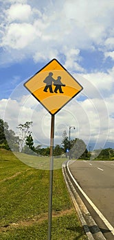 traffic signs on the road to warn many people crossing the road