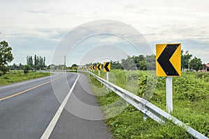 Traffic signs warn that the curve