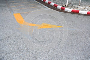 Traffic Signs ,yellow arrow Turning right road sign on the road floor