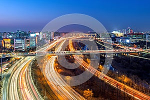 Traffic in Singil district, Korea skyline at night.