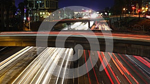 Vehicles blur on Los Angeles freeway at night