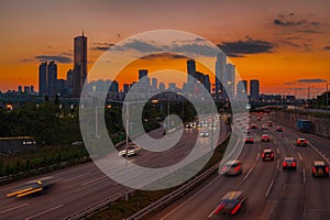 Traffic during sunset at Han river side and skyscraper