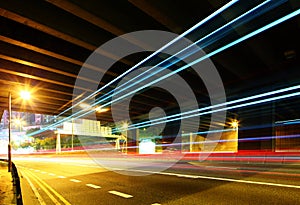 Traffic trail pass though underpass photo