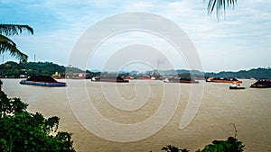 Traffic of tugboats dragging barge of coal at Mahakam river, Samarinda, Indonesia