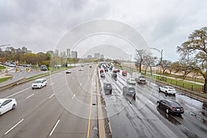 Traffic on a urban highway on a rainy spring day