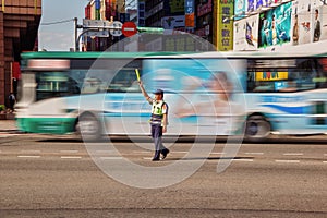 Traffic Warden Directs Moving Morning Peak Hour Traffic in Tapei