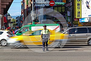 Traffic Warden Directs Peak Hour Traffic in Tapei