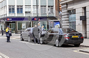 Traffic warden enforcement officer writing out a parking ticket