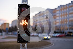 Traffic yellow light forbids bicycle to pass in city