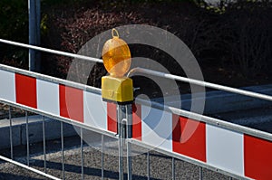 trafic barier red white stripes orange light stom cars people protection sign police path photo