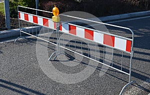 trafic red white stripes orange light stom cars protection sign police path stop parking metal fence prohibited pass way safety photo