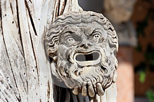 Tragic mask in hand of greek statue of Melpomene, Corfu, Greece