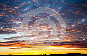 Tragic sky, yellow-pink clouds, sunrise or sunset