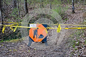 Trail closed sign in forest