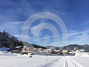 Trail for cross-country skiing with scenic winter snow landscape in Tirol in Achenkirch