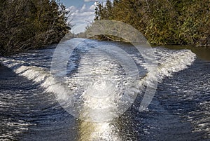 Trail of foam on the water from a motor boat