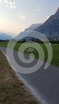 A trail at the foot of the Alps