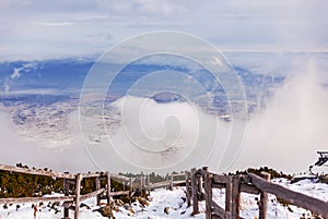 Trail in the High Tatras overlooking the clouds and meadow