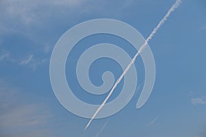 The trail left by a passenger plane in the sky