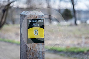 Trail marker post in woods mile marker 0