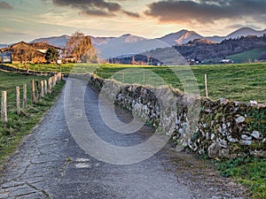 Trail, meadows and rural landscape near La Caye village, Nava municipality, Asturias, Spain photo