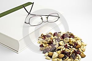 Trail mix, book and eyeglasses