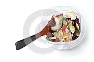 Trail mix container with spoon on white