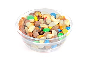 Trail mix in glass bowl over white