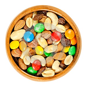 Trail mix in wooden bowl over white