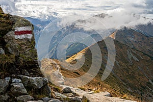 Trail path in Tatra Mountains in cloudy autumn day near Kasprowy Wierch peak