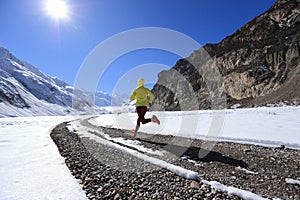 trail runner cross country running in winter nature