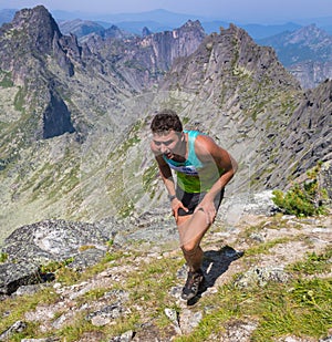 Trail runner, man and success in mountains