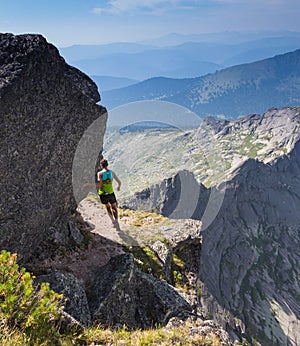 Trail runner, man and success in mountains