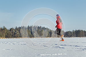 Trail runner man in winter sport race outdoor