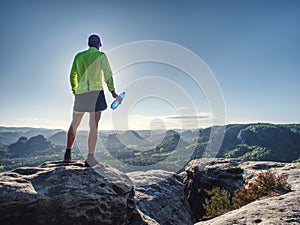 Trail runner in natural terrain, body contour in low ankle view