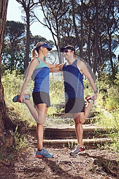 Trail runners stretching