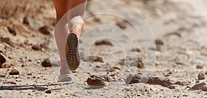 Trail running action close up of running shoe