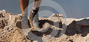 Trail running action close up of running shoes