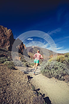 Trail running girl in mountains, inspiration and motivation