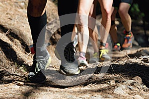 Trail running group on mountain path