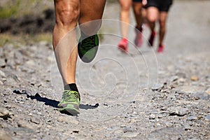 Trail running group on mountain path