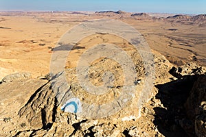 Trail sign direction trailblazing rock desert tourism. photo