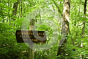 A Trail Sign in a Park Marks a Sensitive Area