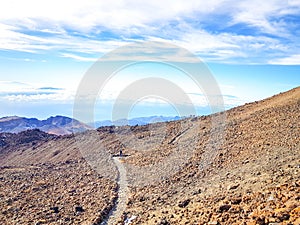 Trail at the top of the Teide with view of the caldera and the island of Tenerife photo