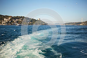 Trail on water surface behind of fast moving motor boat