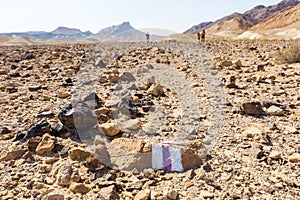 Trailblazing trail marker sign marking backpackers walking stone photo