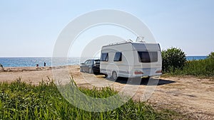 Trailer caravan car by the sea, holidays in the nature outdoor by the sea