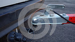 Trailer connected to car. Trailer on car\'s hook. Car hitch.