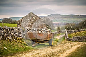 Trailer containing stone next to a barn on the Pennine way above Horton in Ribblesdale