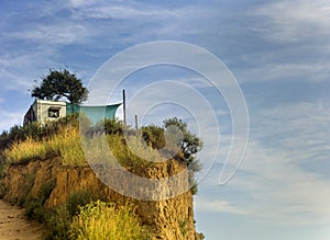 Trailer-house on wheels on the top of a sandstone cliff